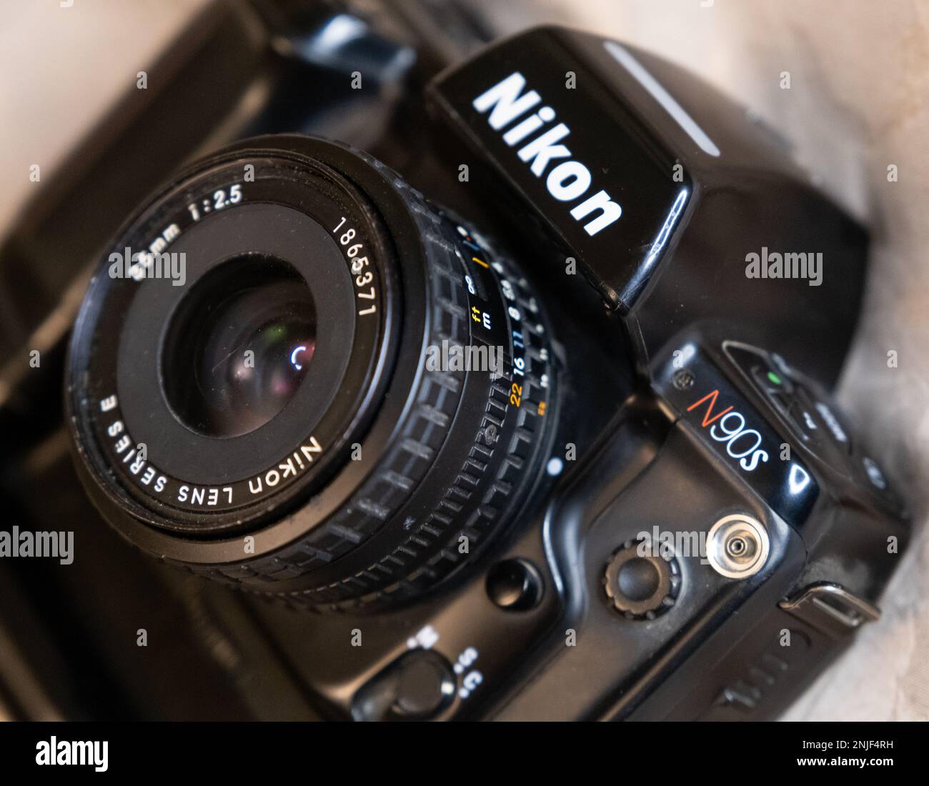 Cairo, Egypt - February 2023: Close up of lens and details of Nikon N90s (F90x) with 35mm f2.5 E Series lens. The N90s is a popular 35mm film autofocu Stock Photo