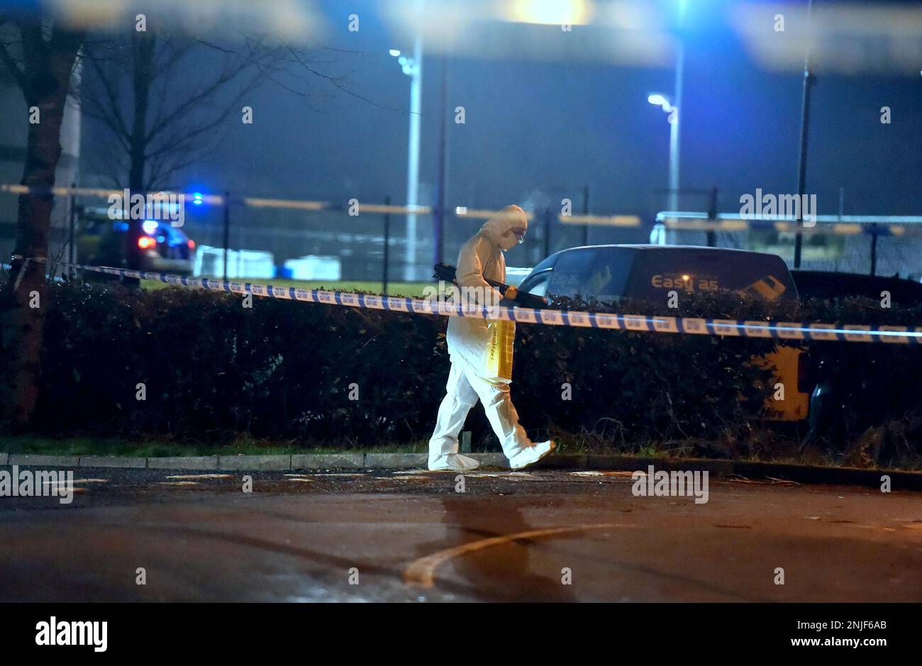 A forensics officer at the scene of a shooting in the Killyclogher Road