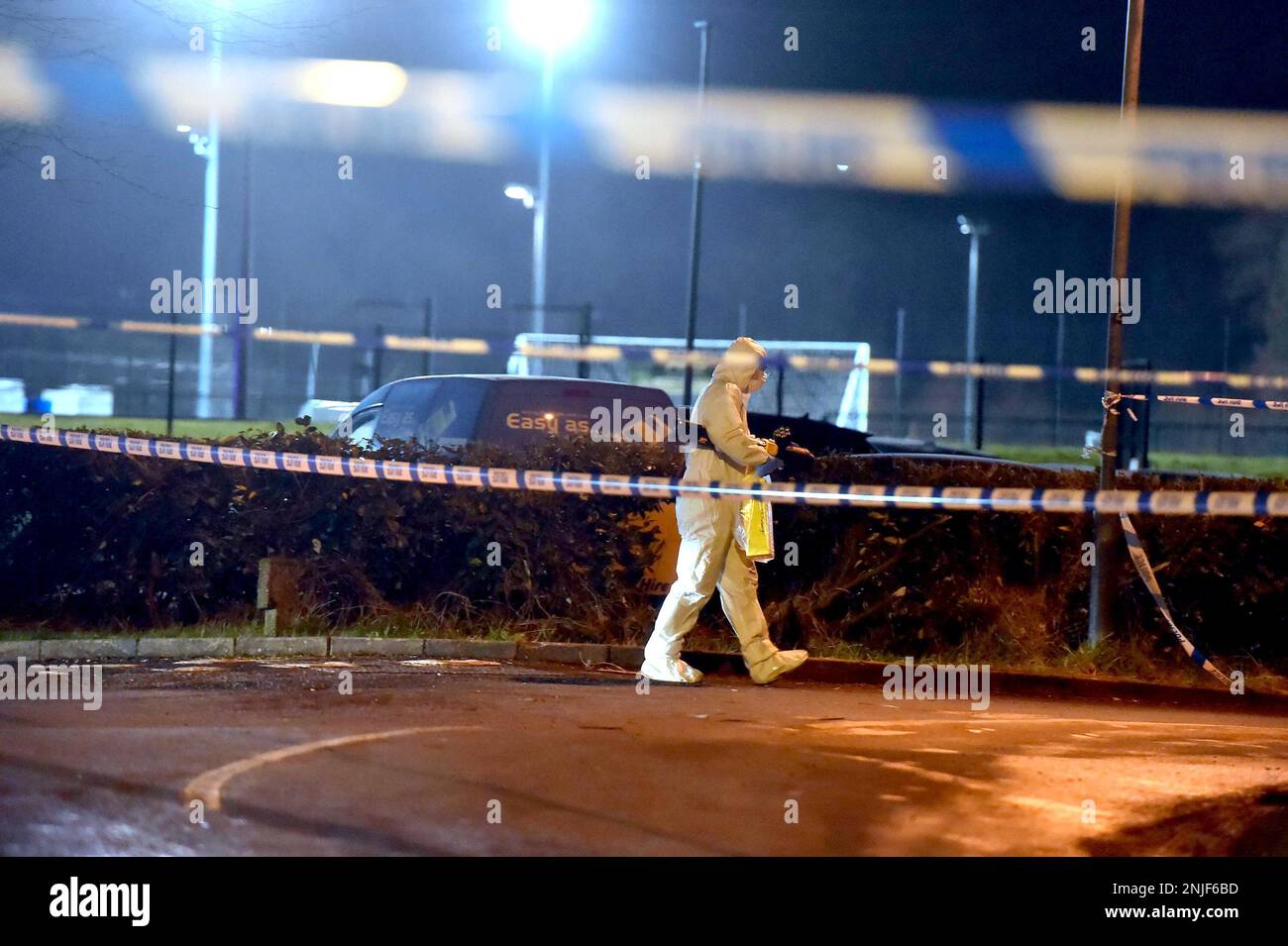 A forensics officer at the scene of a shooting in the Killyclogher Road