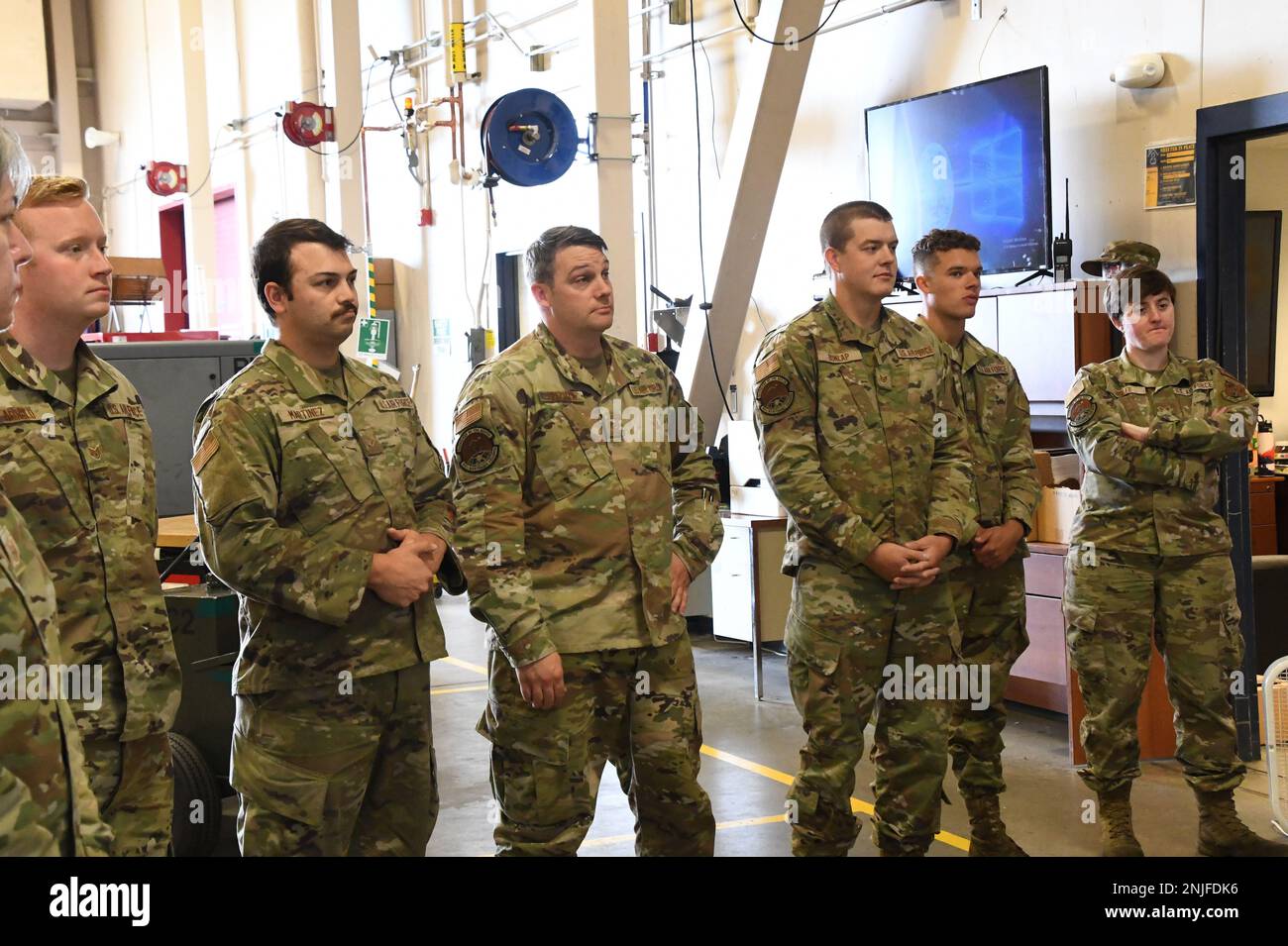 Tech. Sgt. Benjamin Fifer, right, and Staff Sgt. Trevor Correa, center, 168th Maintenance Group, recognized by Col. Michael Griesbaum, 168th Wing Commander, left, Chief Master Sgt. Jeffrey Ling, 168th Wing Command Chief, and Senior Master Sgt. Blair Dellaquila, Wing First Sgt., as superior performers during the Wing Unit Effectiveness Inspection for the Quality Assurance program and Aerospace Ground Equipment Hazardous Material Program. The UEI Capstone occurs every four years and measures four areas: executing the mission, managing resources, leading people, and improving the unit. Stock Photo