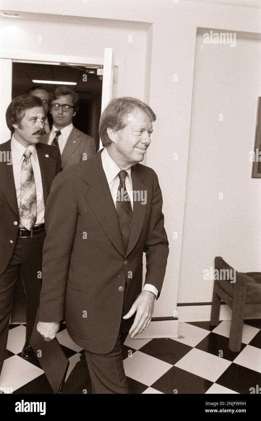 President Jimmy Carter leaves a meeting with White House Counsel ROBERT LIPSHUTZ Stock Photo