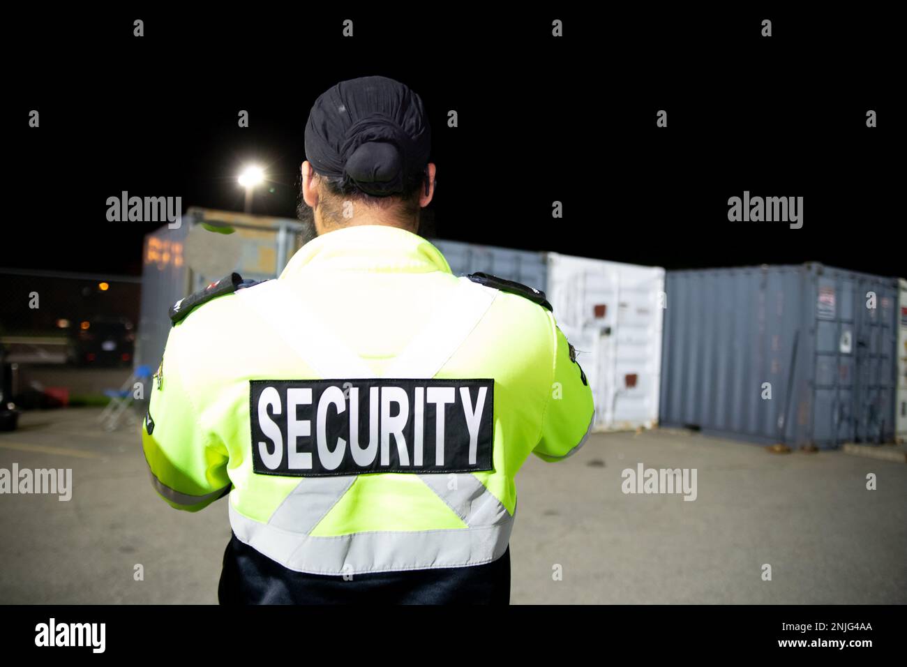 Security guard patrolling at night office Stock Photo
