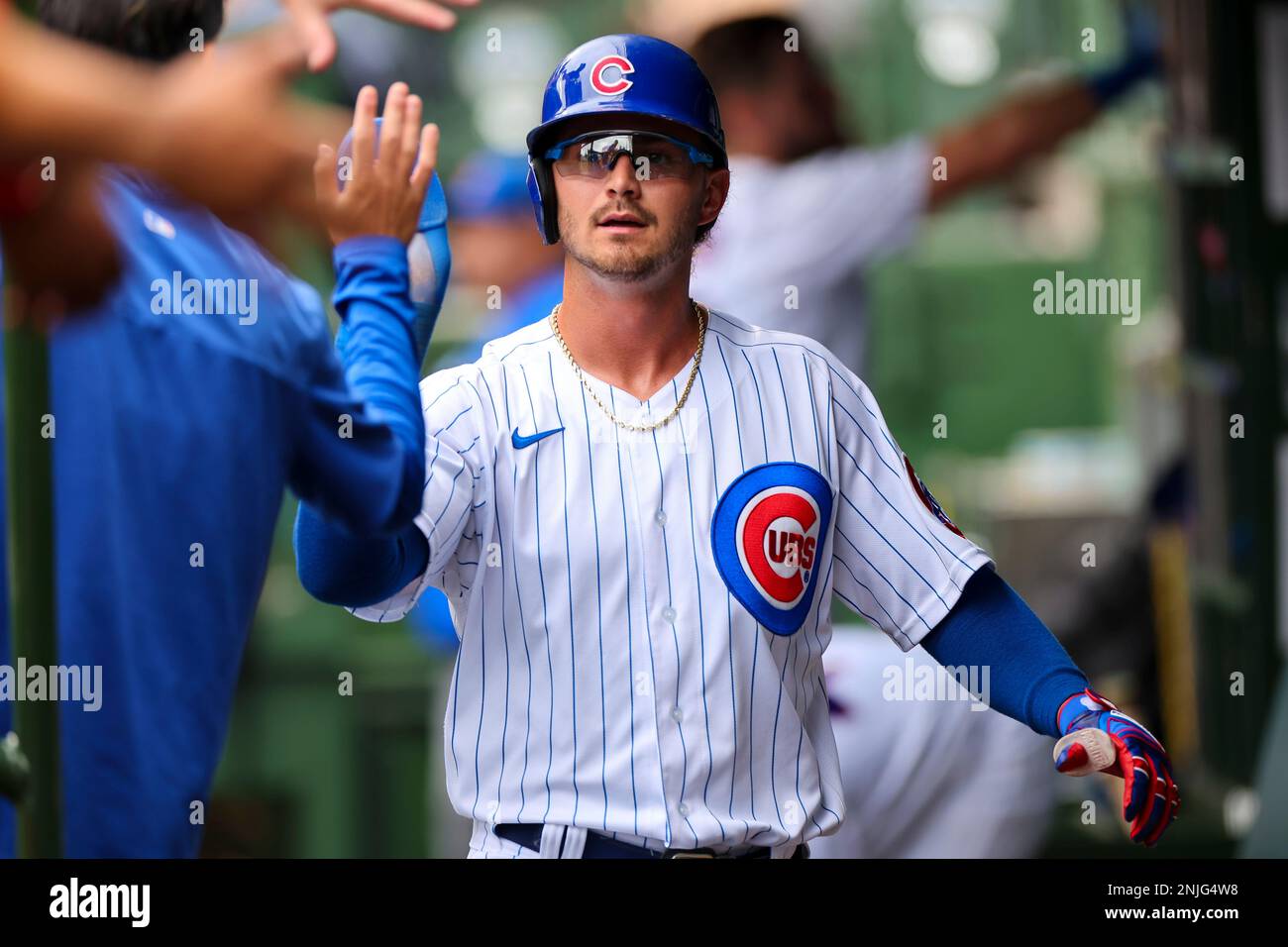 CHICAGO, IL - AUGUST 25: Chicago Cubs second basemen Zach McKinstry (6)  scores in the third inning on a single by left fielder Ian Happ (8) during  a regular season game between