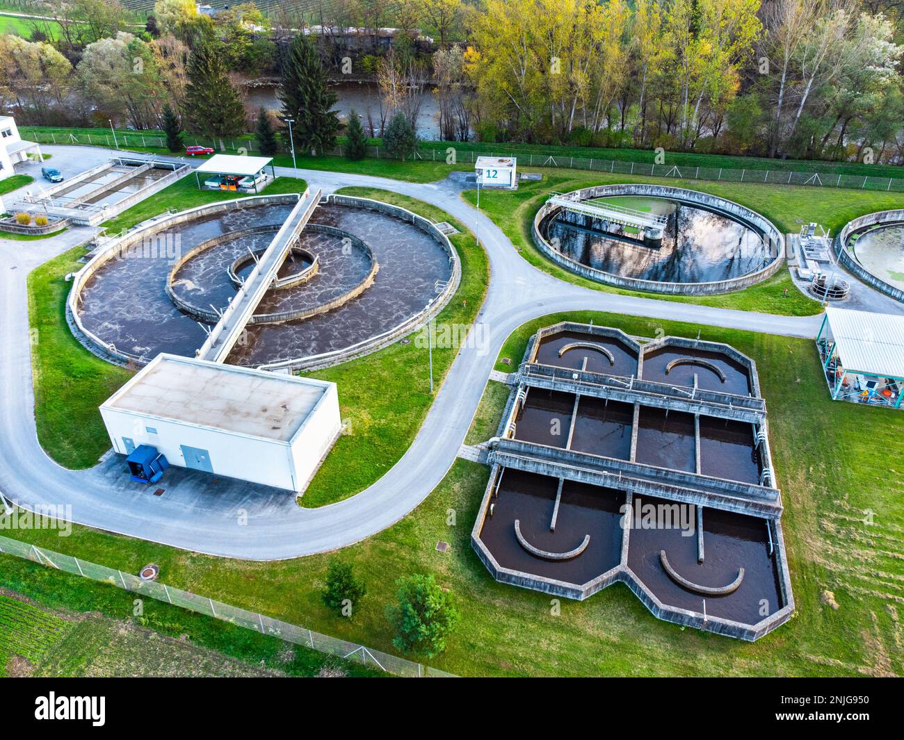 Waste water treatment plant in the country side of Slovenia. Aerial views. Cleaning the environment, taking care of a better future with sewage treatm Stock Photo
