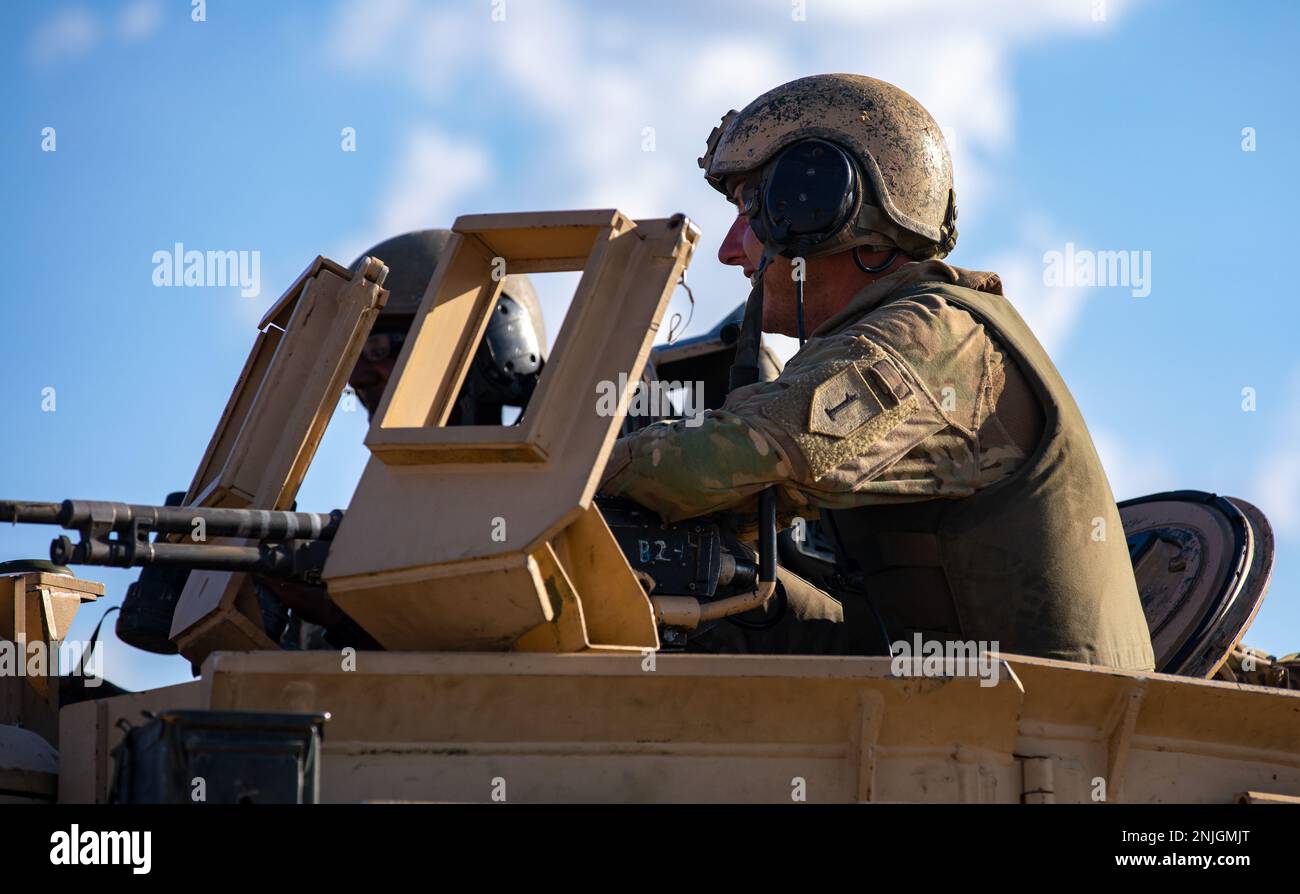 A Soldier assigned to the 1st Battalion, 63rd Armor Regiment, 2nd Armored Brigade Combat Team, 1st Infantry Division maintains security during a battlefield exercise at the National Training Center on Fort Irwin, California, August 7, 2022. The brigade attended the 22-09 rotation at NTC to test their overall unit readiness and adaptability within a combat environment. Stock Photo