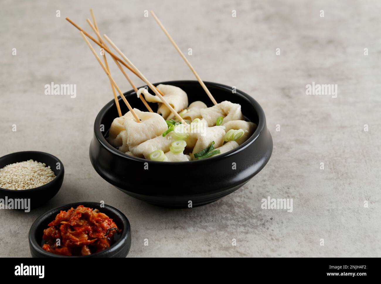 Oemuk Guk or Odeng Tang, Skewer Fish Cake Soup, Popular Korean Street Food. Served with Kimchi Stock Photo