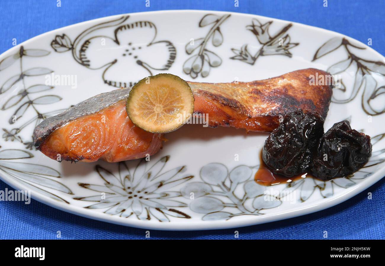 A picture shows a dish of fried salmon flavored with Yuanji in Tokyo