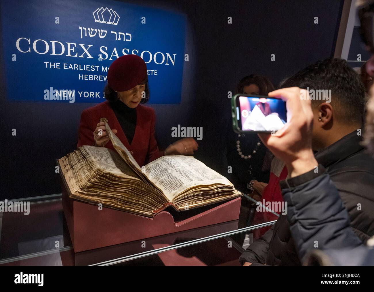 Sotheby’s, London, UK. 22 February 2023 (Image EMBARGOED until 01.00am GMT on Thursday 23 February 2023). The earliest and most complete Hebrew Bible, known as Codex Sassoon, will be offered in New York in May, estimated at $30,000,000-50,000,000, considered one of the most influential books in history. A global tour sees the magnificent volume return to display, beginning with an exhibition 22–28 February at Sotheby’s in London, followed by stops in Tel Aviv, Dallas, Los Angeles and New York City. Credit: Malcolm Park/Alamy Live News. Stock Photo