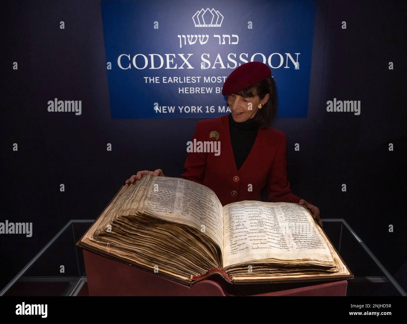 Sotheby’s, London, UK. 22 February 2023 (Image EMBARGOED until 01.00am GMT on Thursday 23 February 2023). The earliest and most complete Hebrew Bible, known as Codex Sassoon, will be offered in New York in May, estimated at $30,000,000-50,000,000, considered one of the most influential books in history. A global tour sees the magnificent volume return to display, beginning with an exhibition 22–28 February at Sotheby’s in London, followed by stops in Tel Aviv, Dallas, Los Angeles and New York City. Credit: Malcolm Park/Alamy Live News. Stock Photo