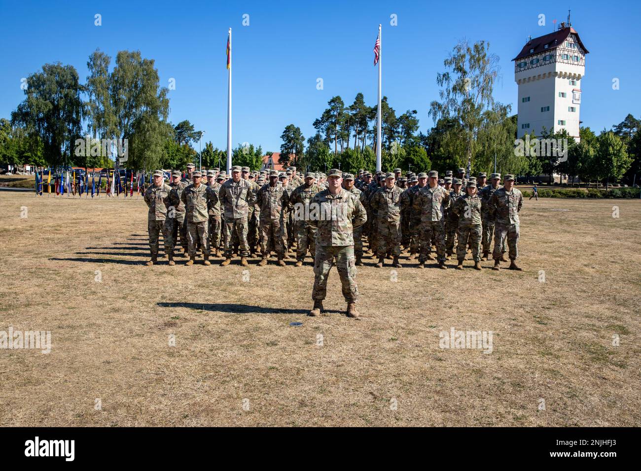 U.S. Army Soldiers assigned to Task Force Orion, 27th Infantry Brigade Combat Team, New York Army National Guard stand in formation during the Joint Multinational Training Group-Ukraine Transfer of Authority ceremony in Grafenwoehr, Germany, August 8, 2022. The unit assumed the JMTG-U mission from Task Force Gator, 53rd Infantry Brigade Combat Team, Florida Army National Guard, and will ensure the combat effectiveness of Ukrainian military personnel training on systems and equipment issued under the United States’ Presidential Drawdown Authority. Stock Photo