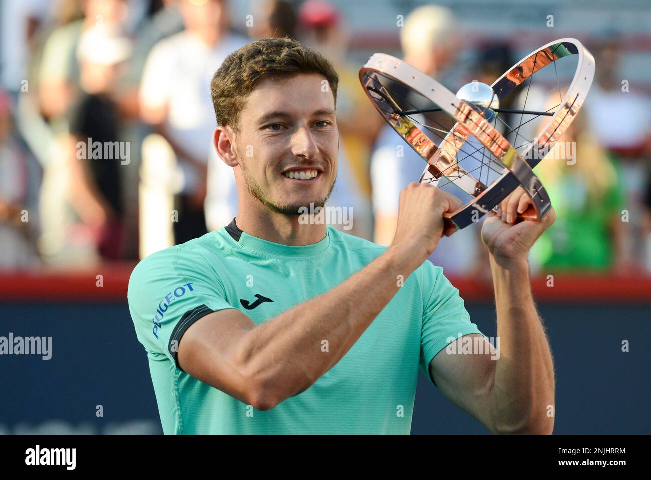 August 14, 2022, Montreal, Quebec, Canada PABLO CARRENO BUSTA of Spain poses with the trophy after winning the National Bank Open tennis tournament in Montreal Canada