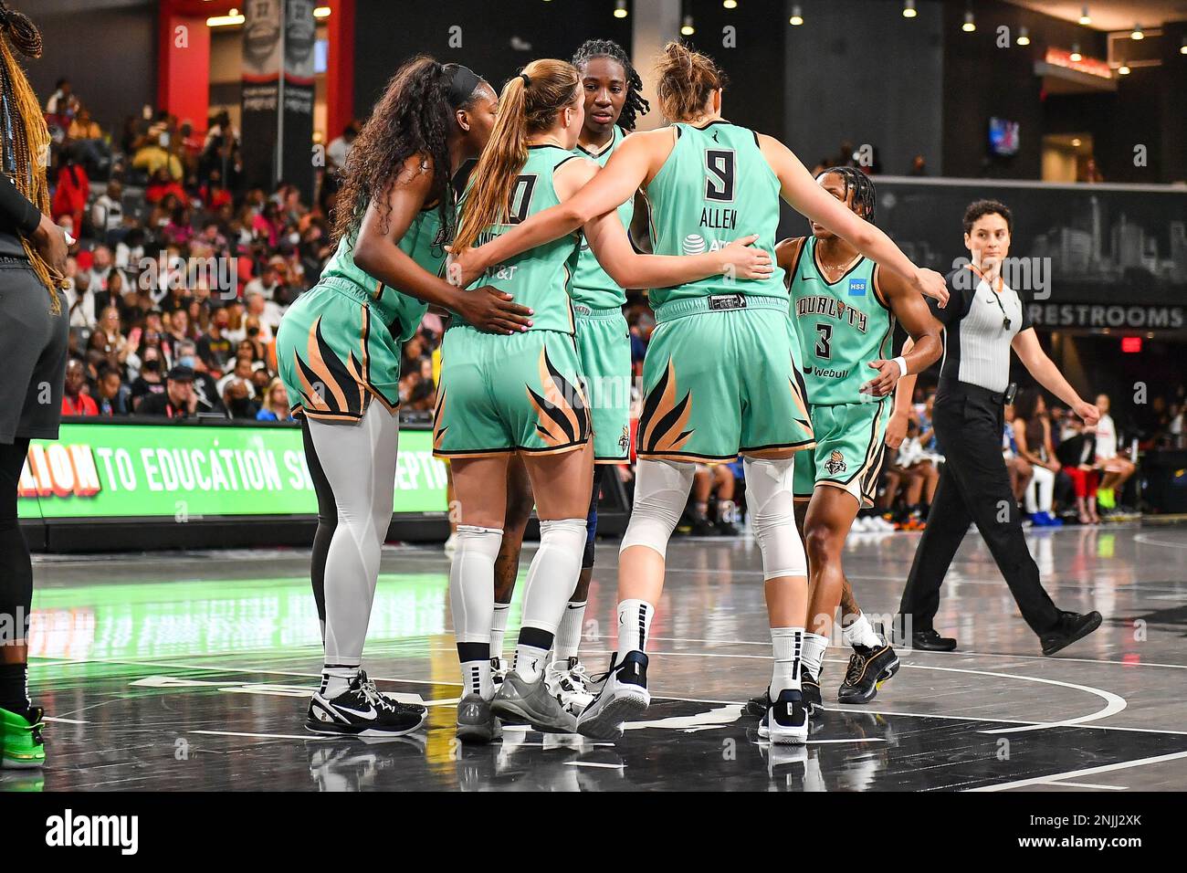 COLLEGE PARK, GA – AUGUST 12: New York players huddle at the free throw  line during the WNBA game between the New York Liberty and the Atlanta Dream  on August 12th, 2022