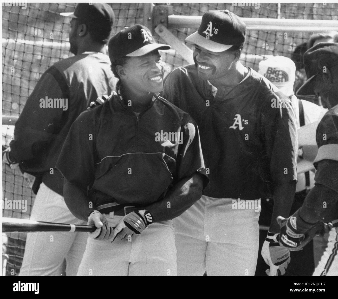 A's players Rickey Henderson (l) and Dave Henderson pose for a picture