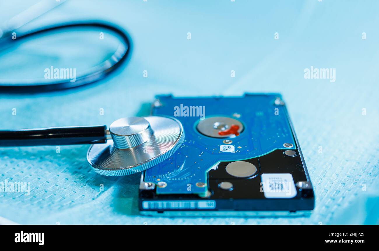 Medical Technology, Health Information Privacy, and Data Storage: Stethoscope on Hard Disk Drive Stock Photo