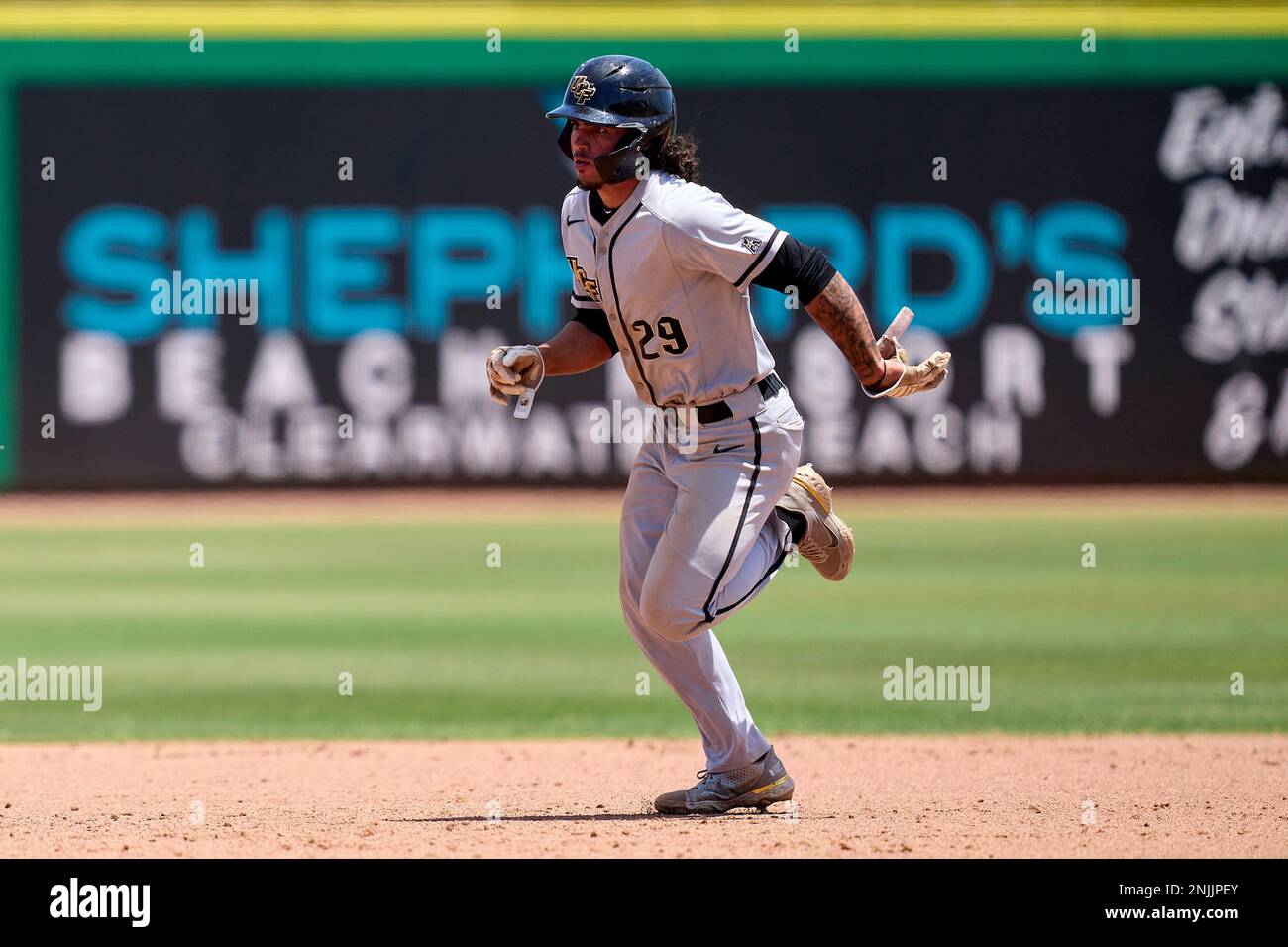 UCF Knights Pablo Ruiz (29) hustles toward third base during an NCAA  baseball game against the Cincinnati Bearcats on May 25, 2021 at BayCare  Ballpark in Clearwater, Florida. (Mike Janes/Four Seam Images