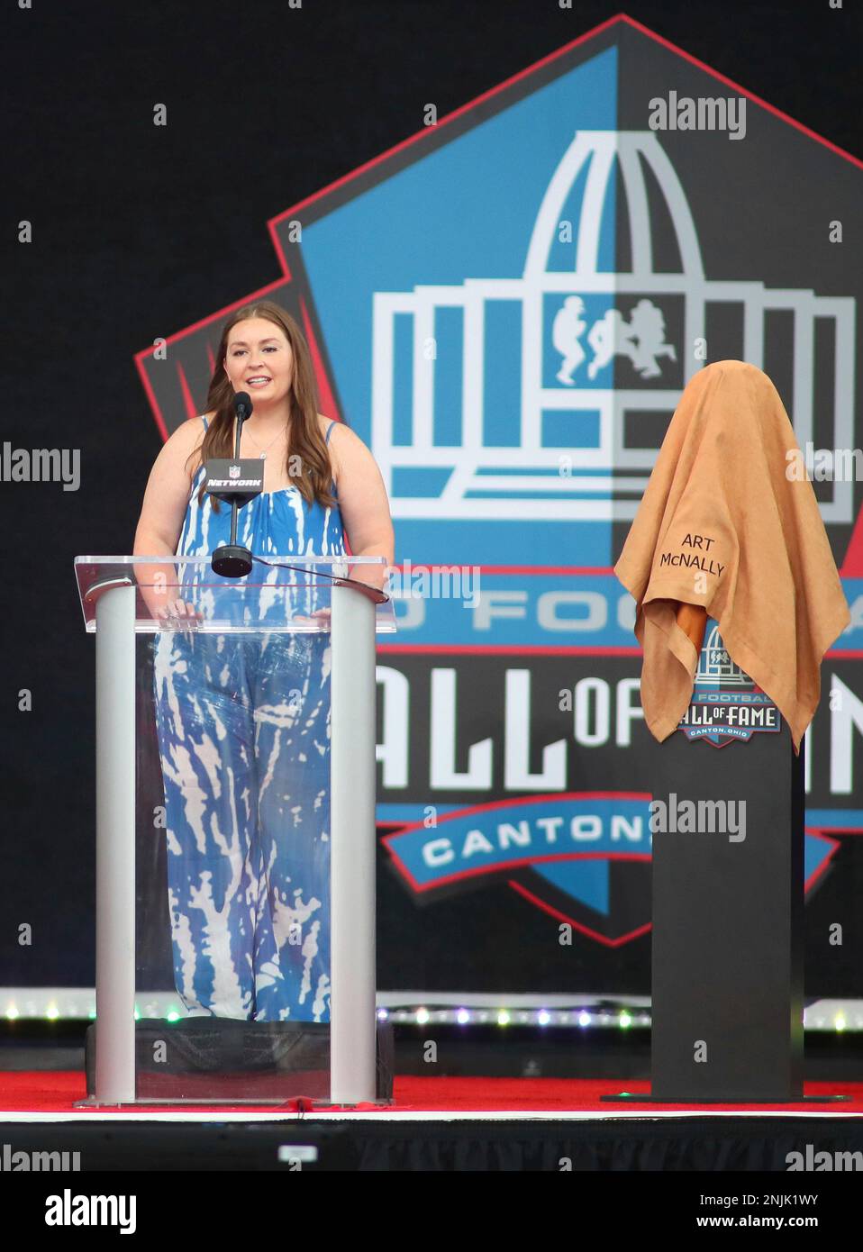 CANTON, OH - AUGUST 06: Shannon McNally grandchild of former NFL official Art  McNally gives a speech during his induction into the Pro Football Hall of  Fame on August 6, 2022 at