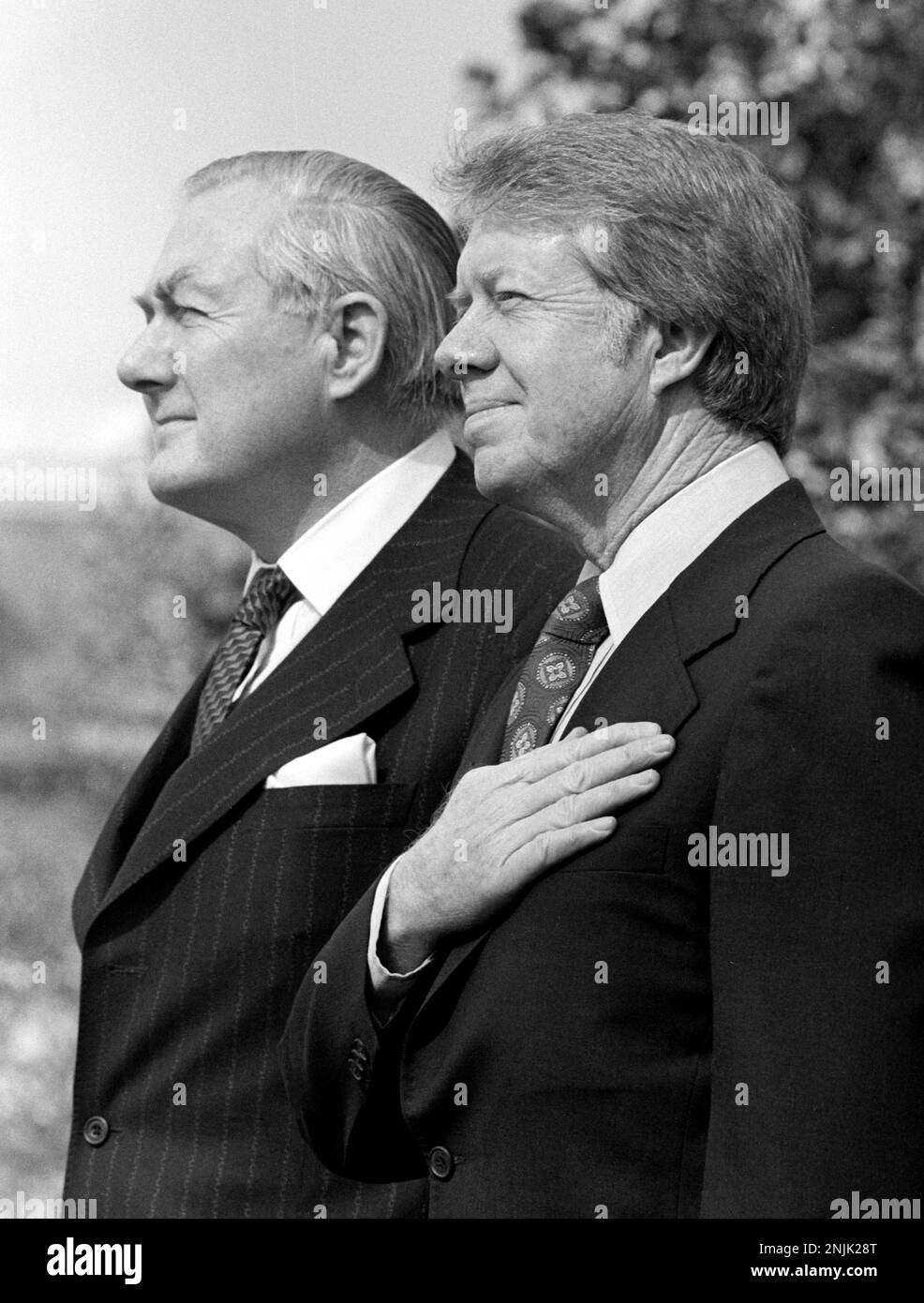 United States President Jimmy Carter, right, and Prime Minister James Callaghan of the United Kingdom of Great Briitain and Northern Ireland, left, on the South Lawn of the White House in Washington, DC during the Official Arrival ceremony on March 10, 1977Credit: Benjamin E. 'Gene' Forte/CNP/Sipa USA Credit: Sipa USA/Alamy Live News Stock Photo
