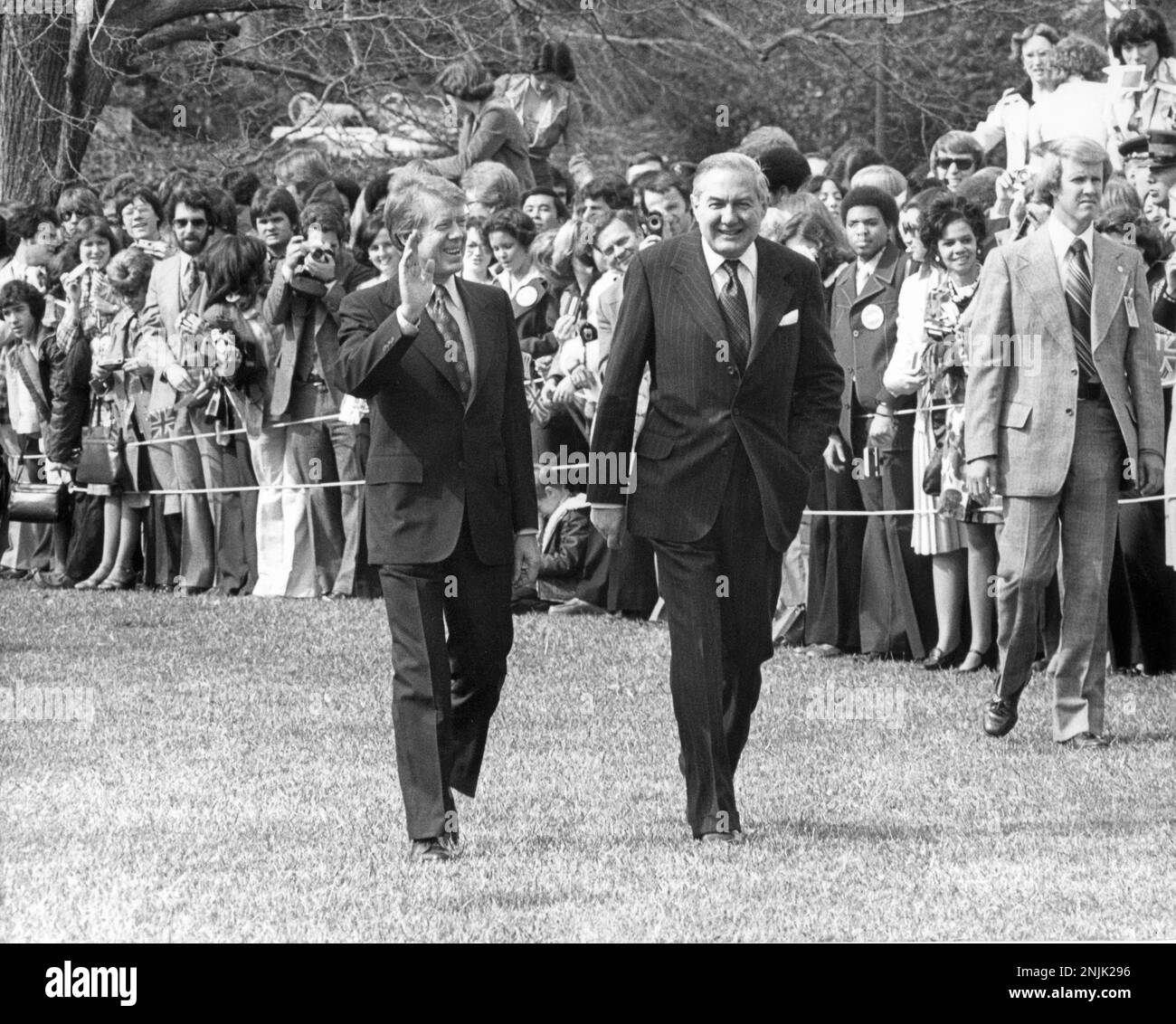 United States President Jimmy Carter, left, waves to the crowd after he and Prime Minister James Callaghan of the United Kingdom of Great Britain and Northern Ireland, right, finished trooping the line during the Official Arrival ceremony on the South Lawn of the White House in Washington, DC on March 10, 1977Credit: Benjamin E. 'Gene' Forte/CNP/Sipa USA Credit: Sipa USA/Alamy Live News Stock Photo