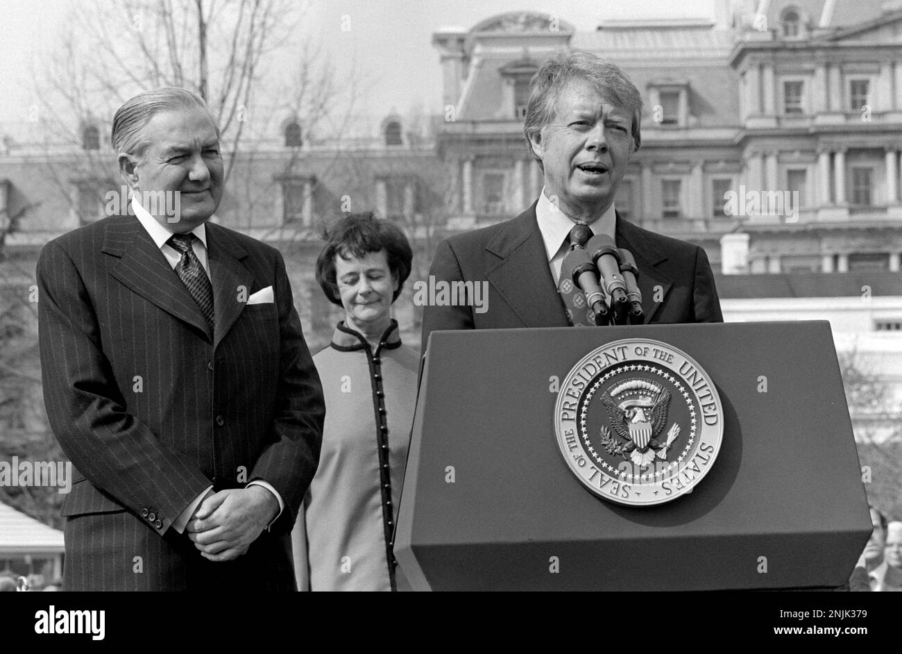 United States President Jimmy Carter, right, makes remarks as he welcomes Prime Minister James Callaghan of the United Kingdom of Great Briitain and Northern Ireland, left, during an Official Arrival ceremony on the South Lawn of the White House in Washington, DC on March 10, 1977. Mrs. James (Audrey) Callaghan, center, observes.Credit: Benjamin E. 'Gene' Forte/CNP/Sipa USA Credit: Sipa USA/Alamy Live News Stock Photo