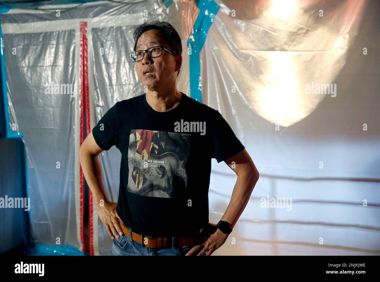 Biscuits and Blues owner Steven Suen views the damage to his in San Francisco, Calif