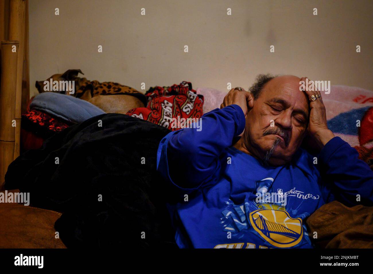 After a long day José rests his head in his hands as he relaxes on his  couch, the Òman caveÓ as he calls it, June 3, 2019, in his home in San