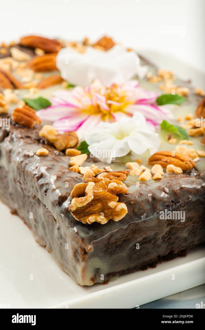 Freshly baked chocolate loaf cake with a variety of crushed nuts Stock ...