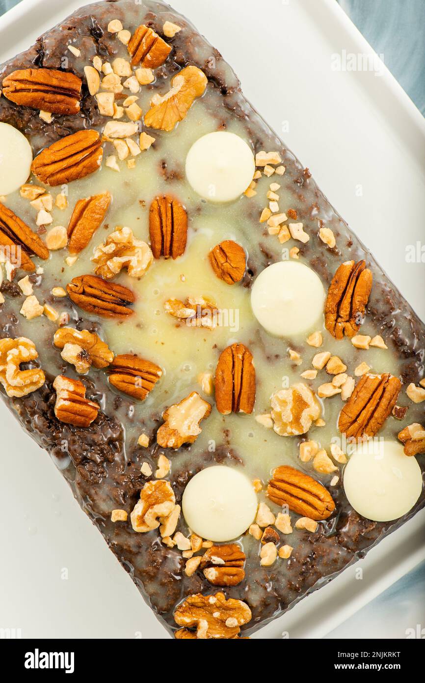 Freshly baked chocolate loaf cake with a variety of crushed nuts Stock ...