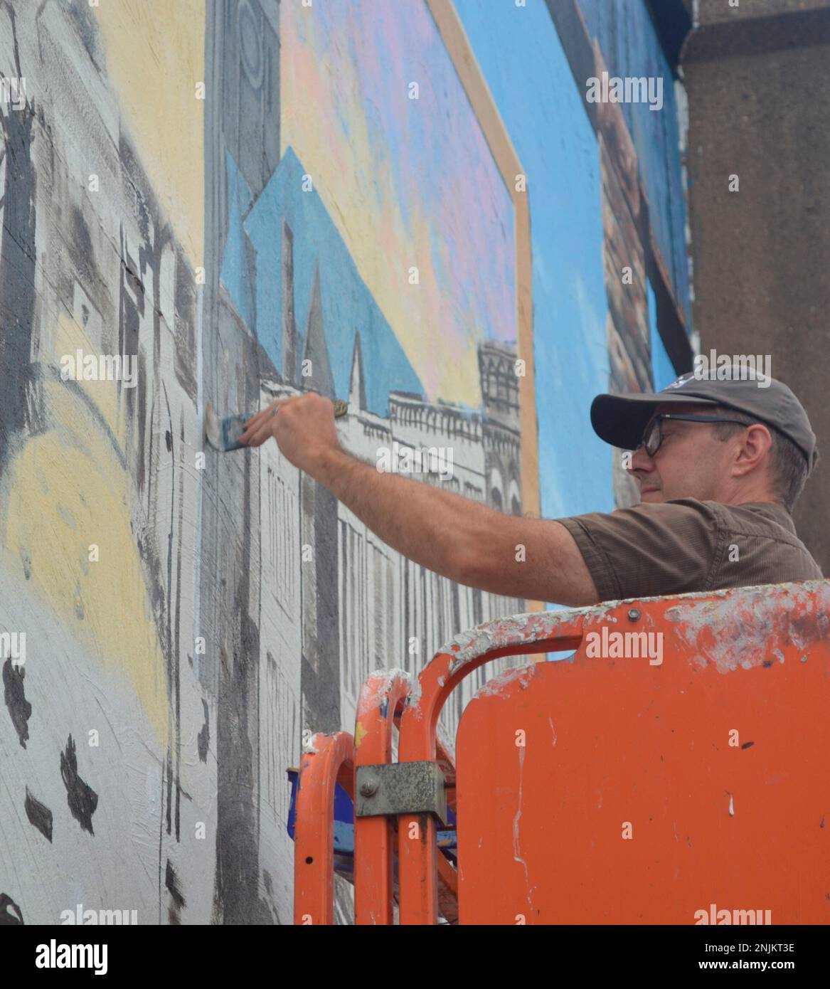Artist Christopher Santer works Tuesday, Aug. 2, 2022, on a scene
