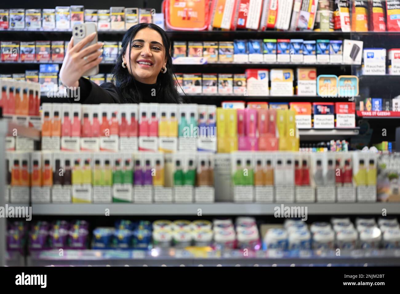 Oldenburg, Germany. 22nd Feb, 2023. Esra Cayir, who has 1.8 million  followers as the "Gas Station Lady" on Tiktok, stands behind the counter in  the gas station and produces new content for