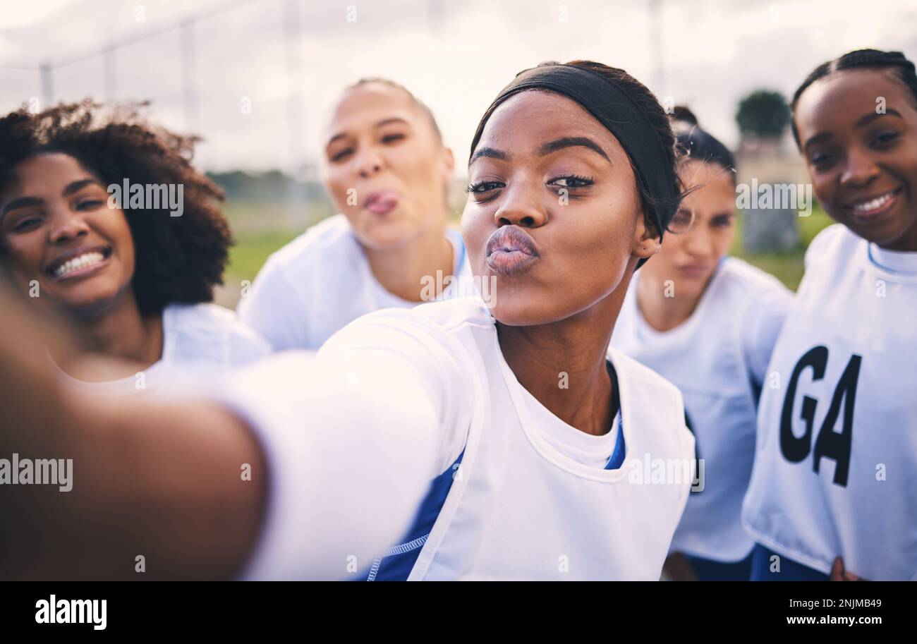 Netball, selfie and portrait of women students on a outdoor sports court for game or workout. Exercise, kiss face and athlete group together for sport Stock Photo
