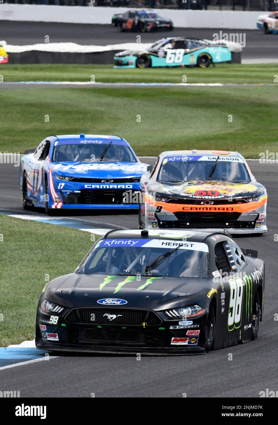 INDIANAPOLIS, IN - JULY 30: Riley Herbst (#98 Stewart Haas Racing Monster  Energy Ford) leads Noah Gragson (#9 JR Motorsports Bass Pro Shops  TrueTimber BRCC Chevrolet) and Alex Bowman (#17 Hendrick Motorsports