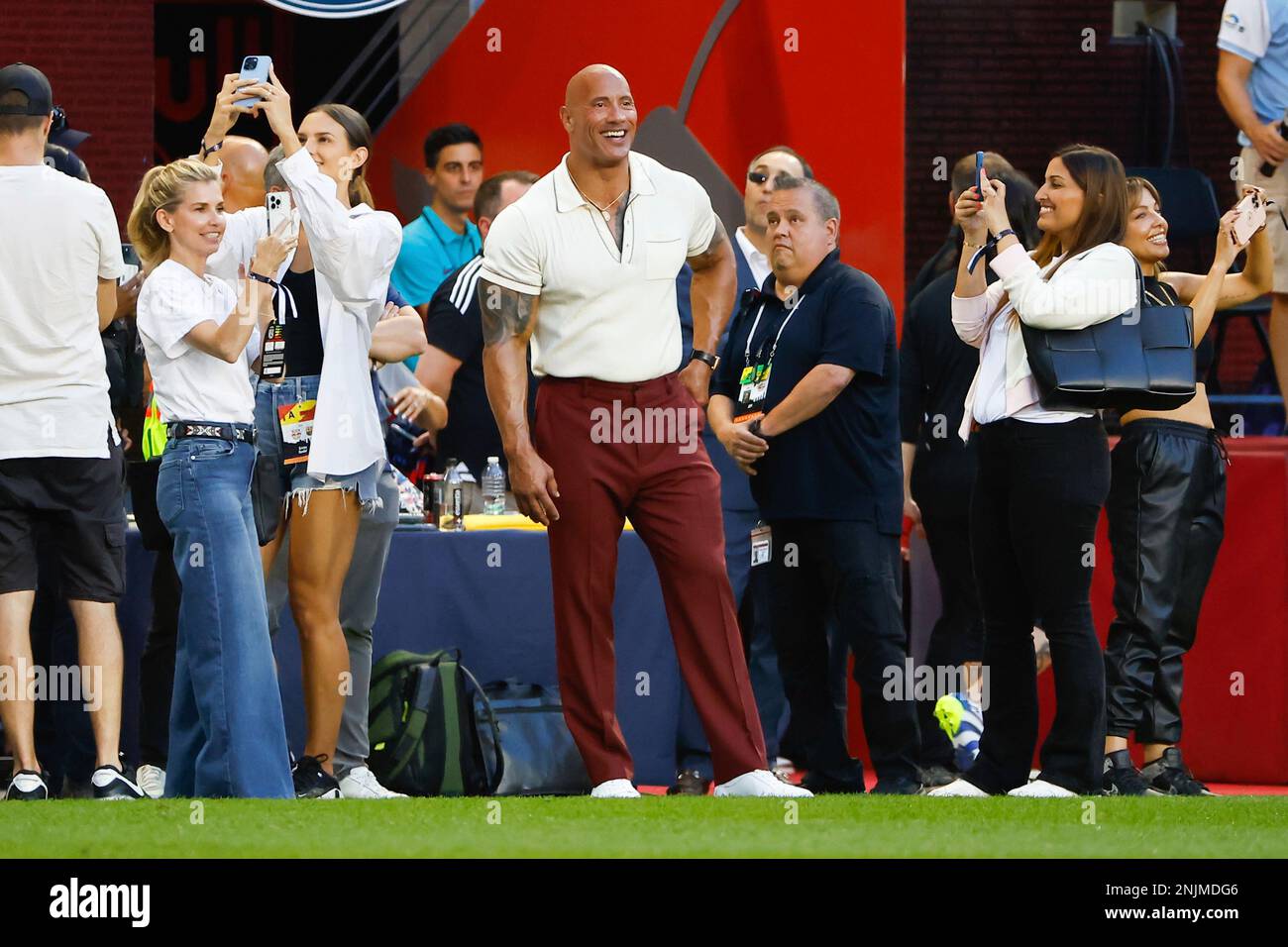 HARRISON, NJ JULY 30 Actor Dwayne Johnson watches his wife Lauren