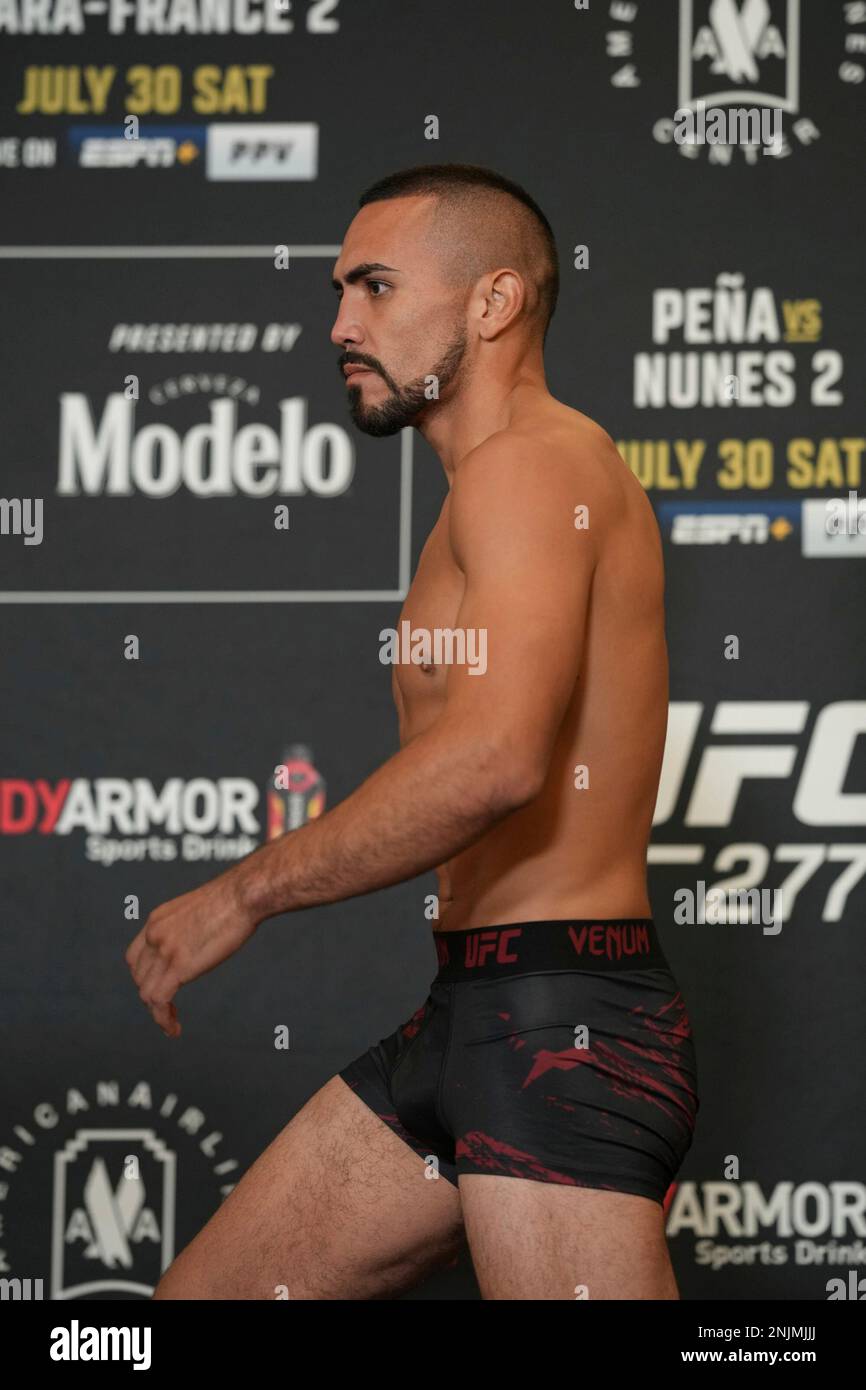 DALLAS, TX - JULY 29: Rafa Garcia steps on the scale for the official fight  weigh-in for UFC 277 on July 29, 2022, at the Hyatt Regency Dallas in  Dallas, TX. (Photo