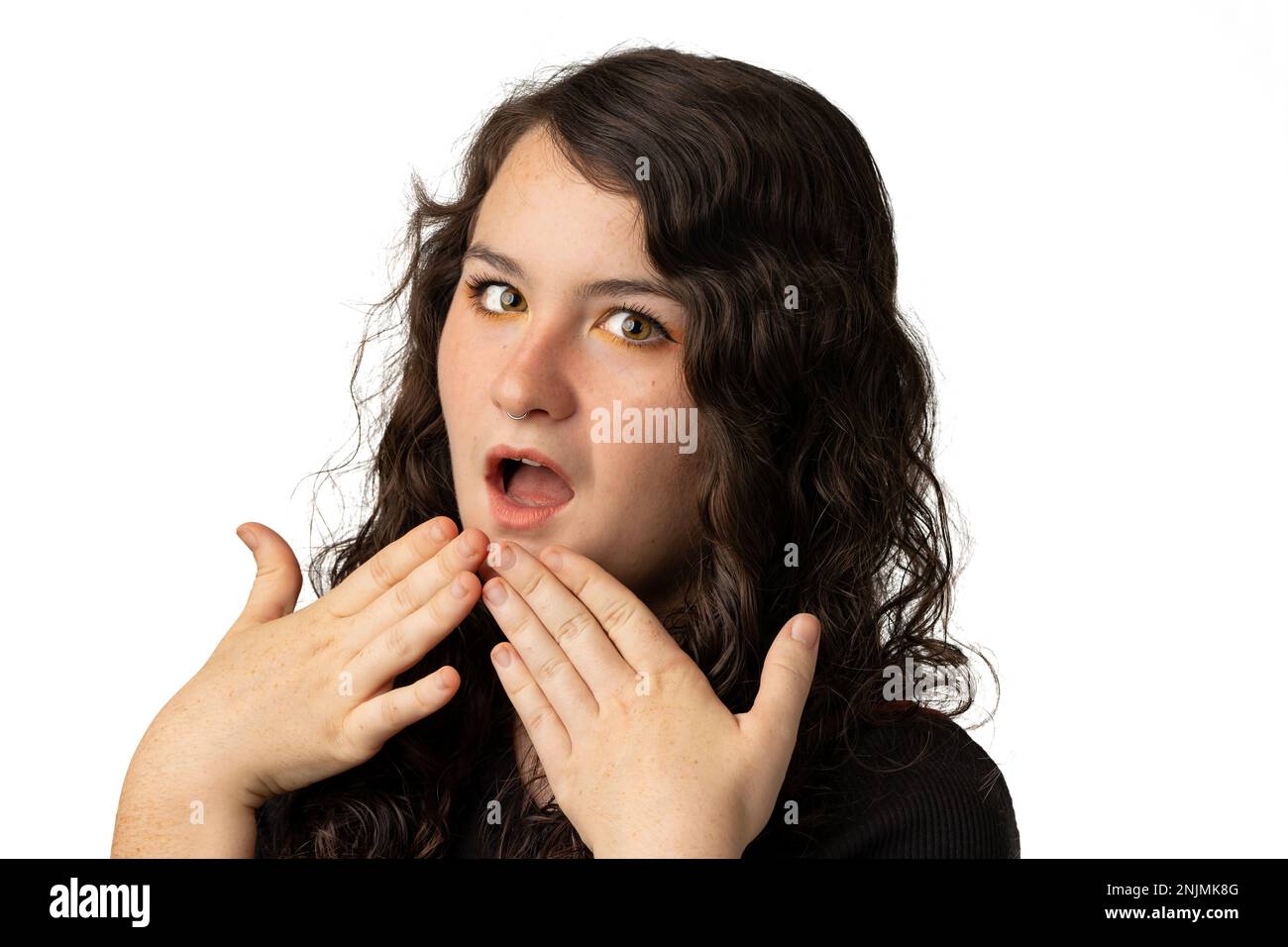Young woman with surprised gesture on white background Stock Photo
