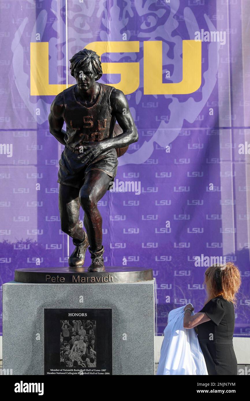 July 25, 2022: Jackie Maravich poses with a small statue with her son's  Josh Maravich and