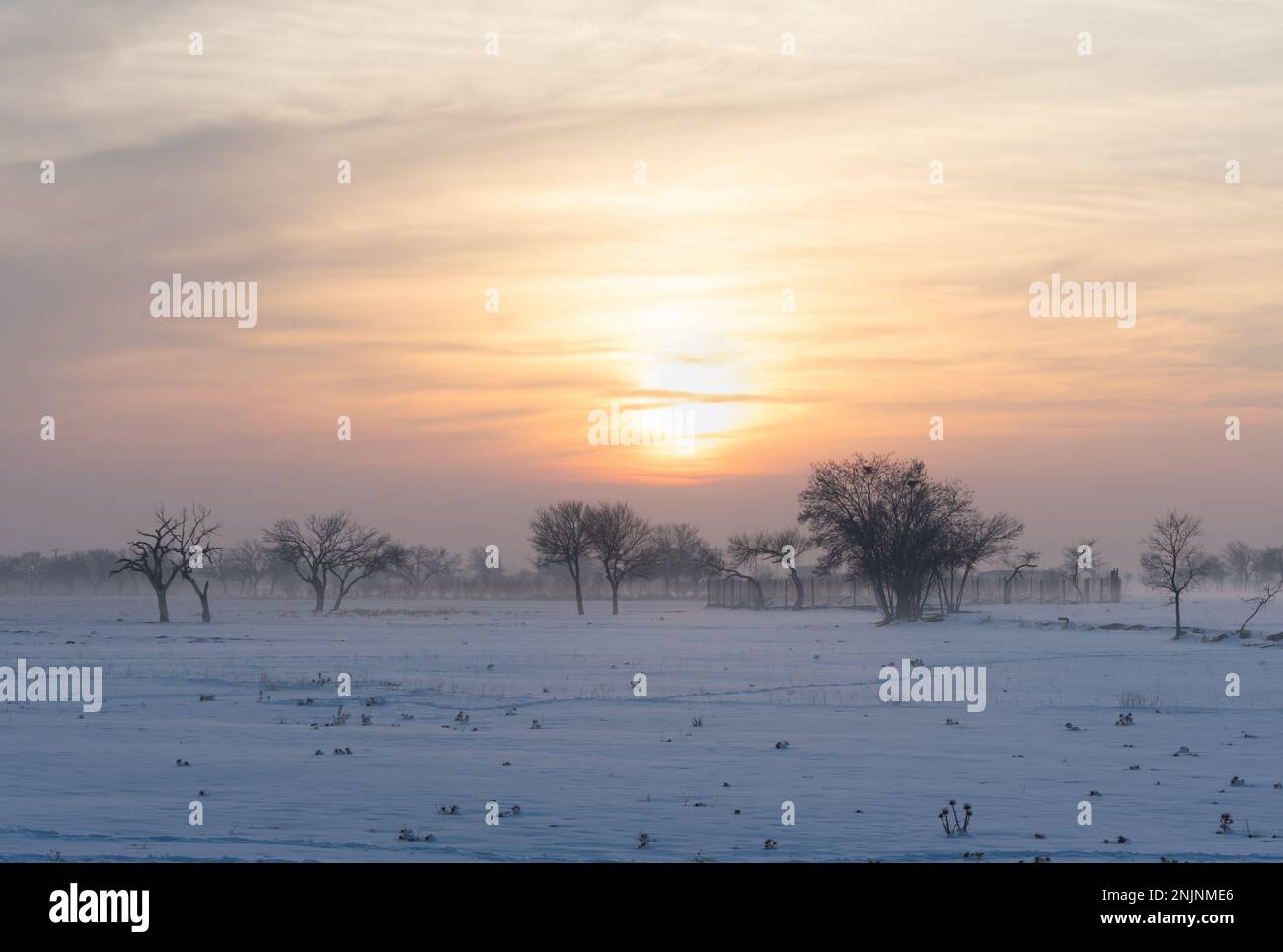 sunset in fog Stock Photo