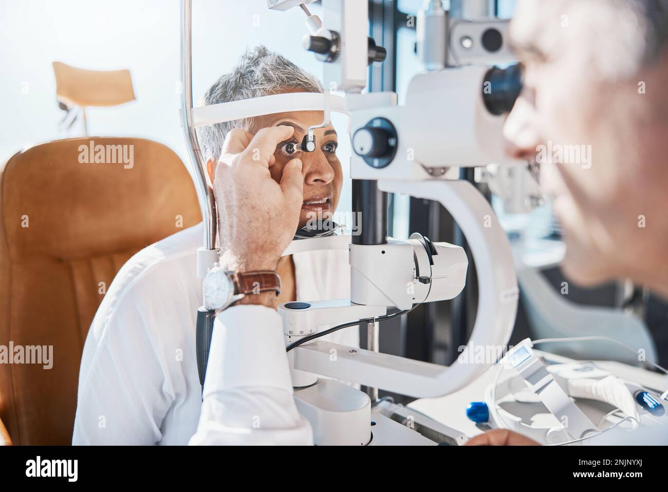 Senior eye exam, check and medical eyes test of elderly woman
