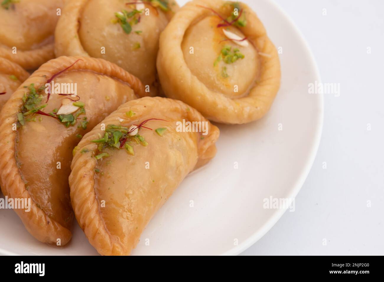 Chandrakala And Gujiya Mithai Also Called Suryakala, Gujia, Pirukiya, Pirukia, Pedakiya, Karanji, Basundi, Gughra Is Made Of Suji Ghee, Mawa Khoya Cha Stock Photo