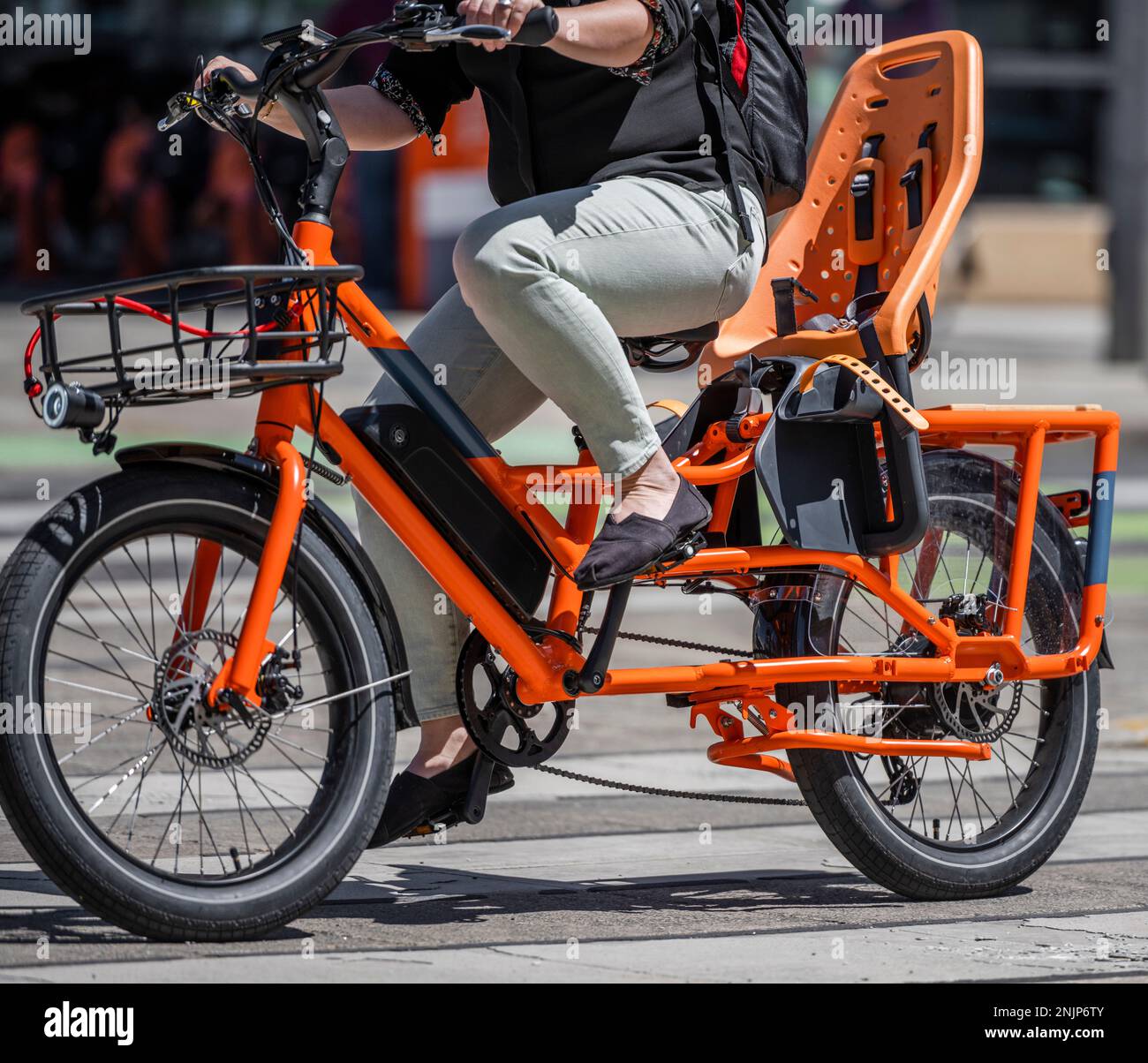 A woman on electric bicycle and cycling rides are great tools for