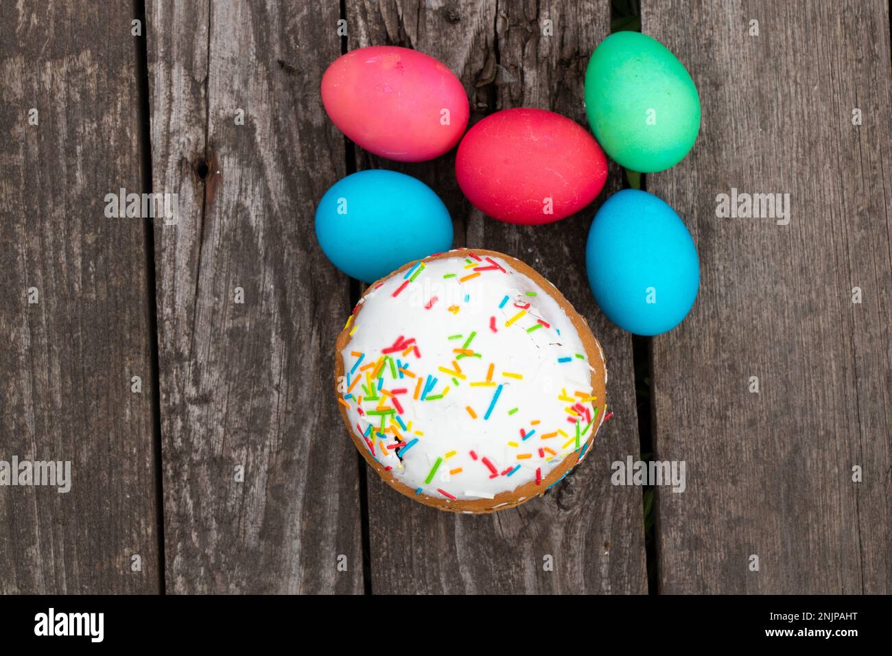 easter eggs lie on a wooden board and easter eggs Stock Photo