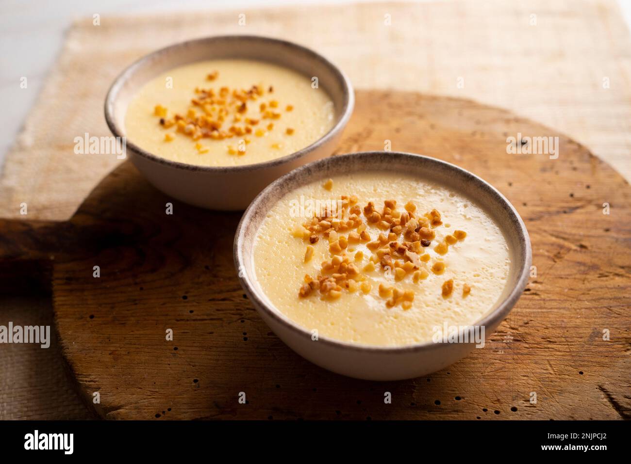 Custard is a dairy dessert that is widespread in Spanish gastronomy. It is a cream made with milk, egg yolks, sugar and aromas such as vanilla or lemo Stock Photo