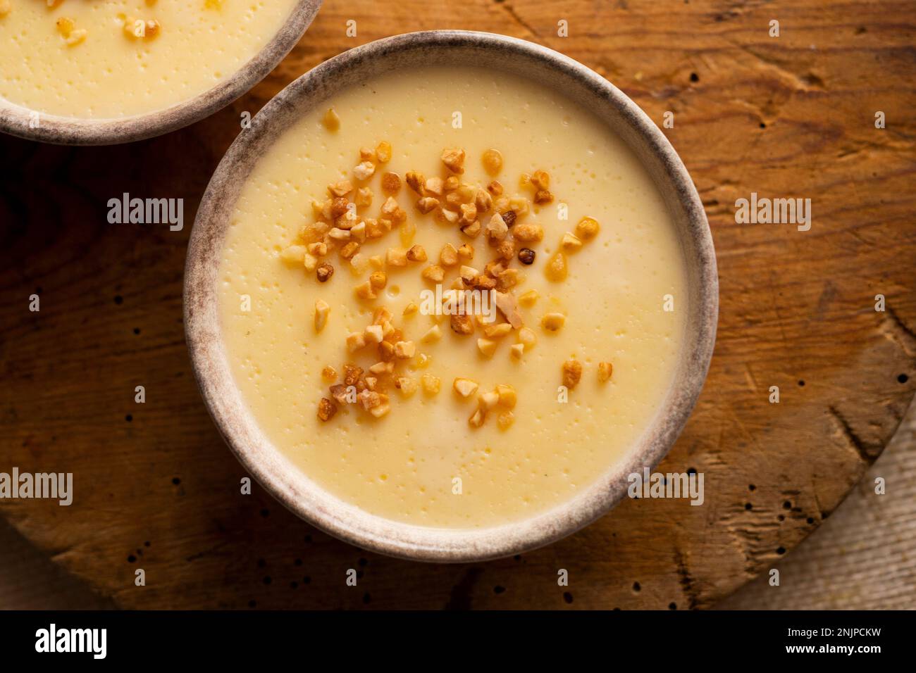 Custard is a dairy dessert that is widespread in Spanish gastronomy. It is a cream made with milk, egg yolks, sugar and aromas such as vanilla or lemo Stock Photo