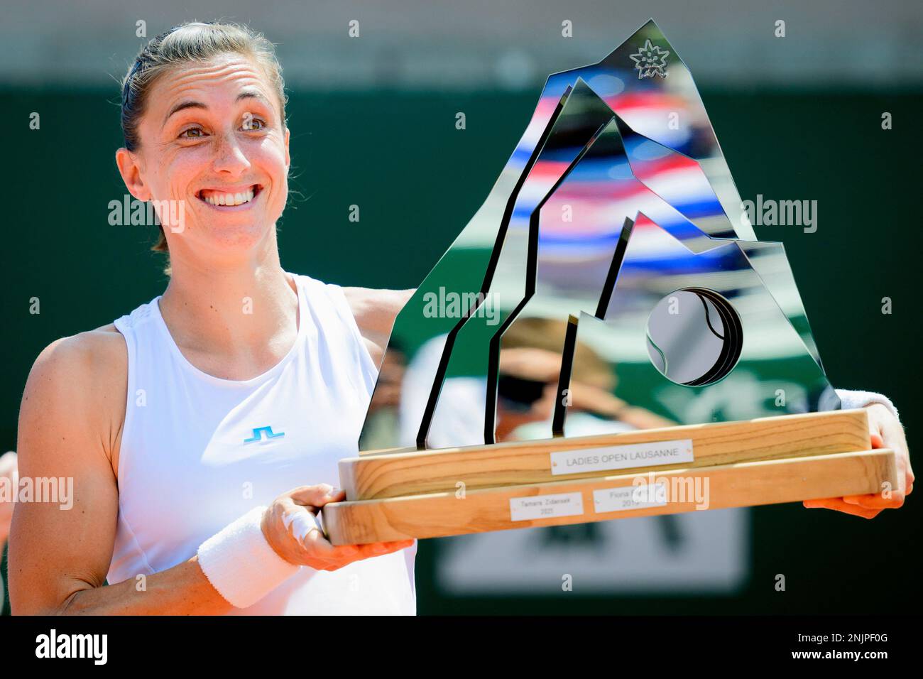 Croatias Petra Martic celebrates her victory with the trophy after the final match against Serbias Olga Danilovic at the WTA International Ladies Open Lausanne tennis tournament, in Lausanne, Switzerland, Sunday, July 17,