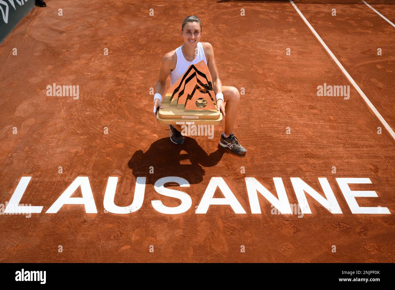 Croatias Petra Martic celebrates her victory with the trophy after the final match against Serbias Olga Danilovic at the WTA International Ladies Open Lausanne tennis tournament, in Lausanne, Switzerland, Sunday, July 17,