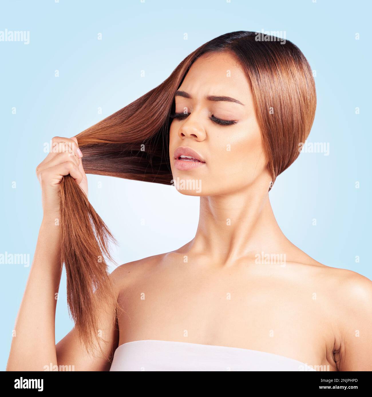 Face, beauty and hair loss of sad woman in studio isolated on a blue background. Mistake, haircare and unhappy female model with hairstyle problem Stock Photo