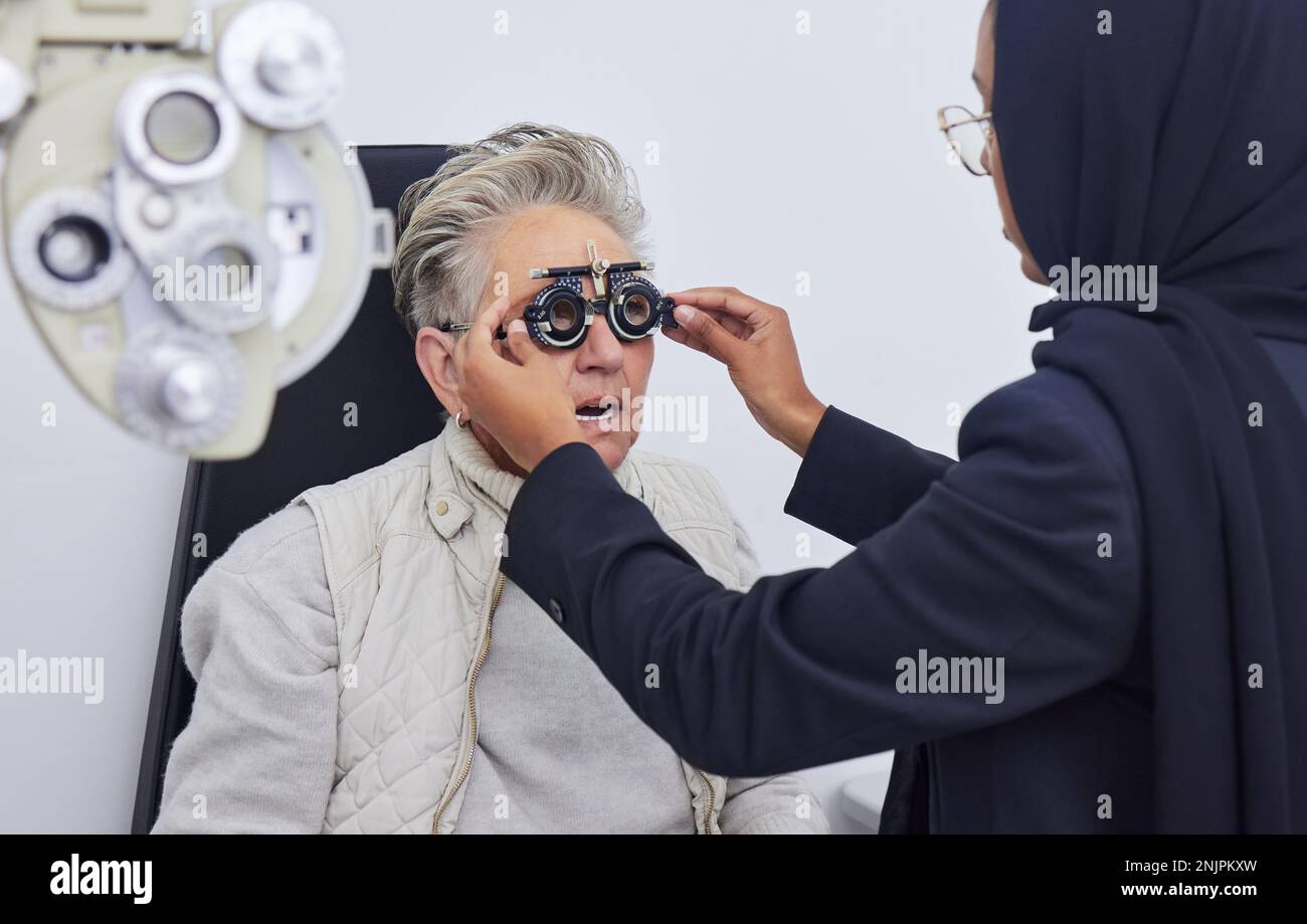 Eye exam, glasses and senior woman with optometrist in clinic for