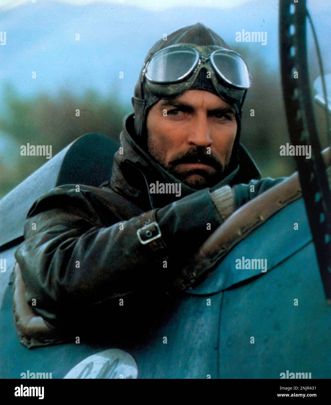 TOM SELLECK in HIGH ROAD TO CHINA (1983), directed by BRIAN G. HUTTON. Credit: GOLDEN HARVEST-JADRAN/WB / Album Stock Photo