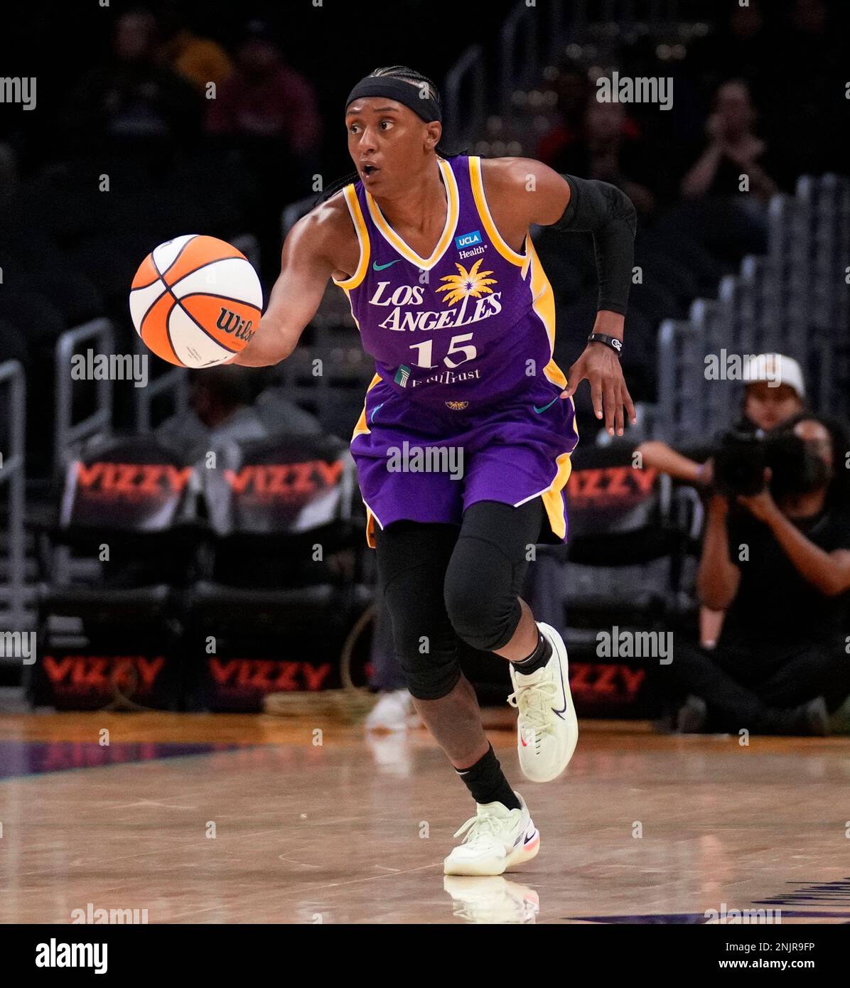 Guard Brittney Sykes #15 of the Los Angeles Sparks controls the ball  against the Washington Mystics in the first half of a WNBA basketball game  at Crypto.com in Los Angeles on Tuesday,