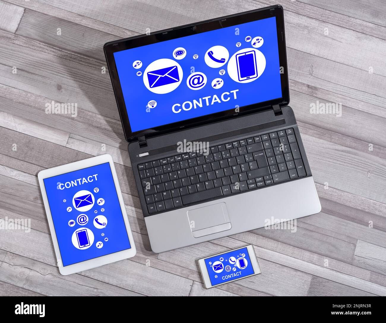 Contact concept shown on different information technology devices Stock Photo