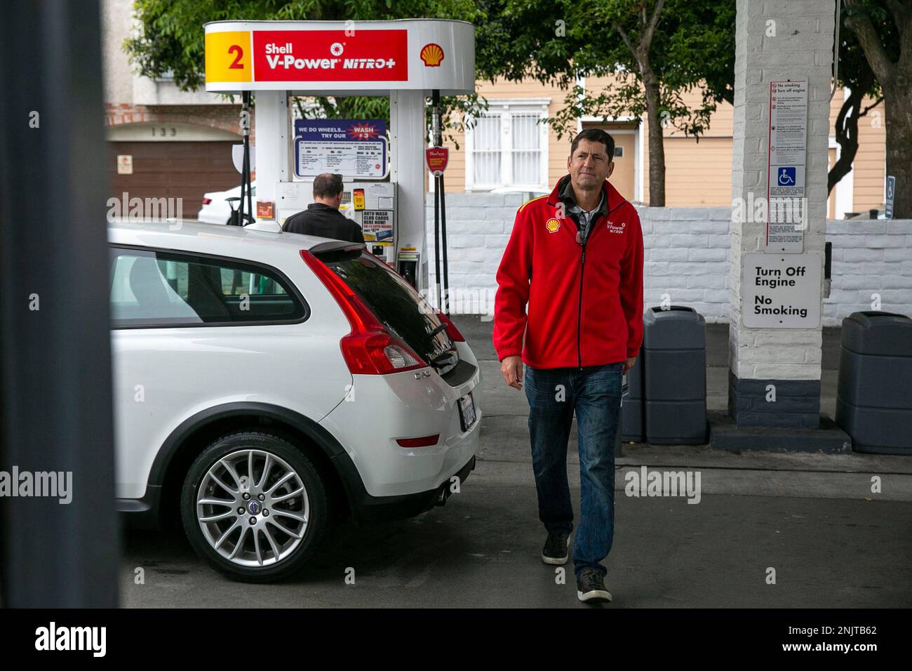Corey Urban walks through the Shell gas station on Geary Boulevard 